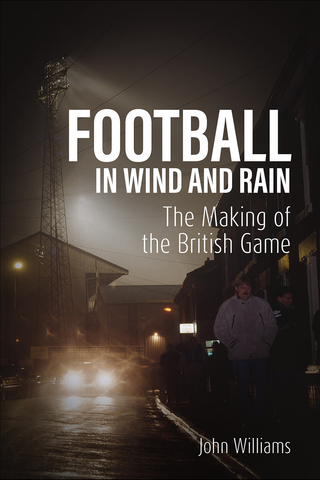 FOOTBALL IN WIND AND RAIN